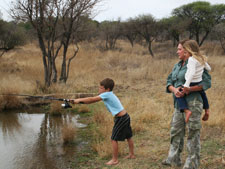 Christiaan showing off his fishing skills to Leesa