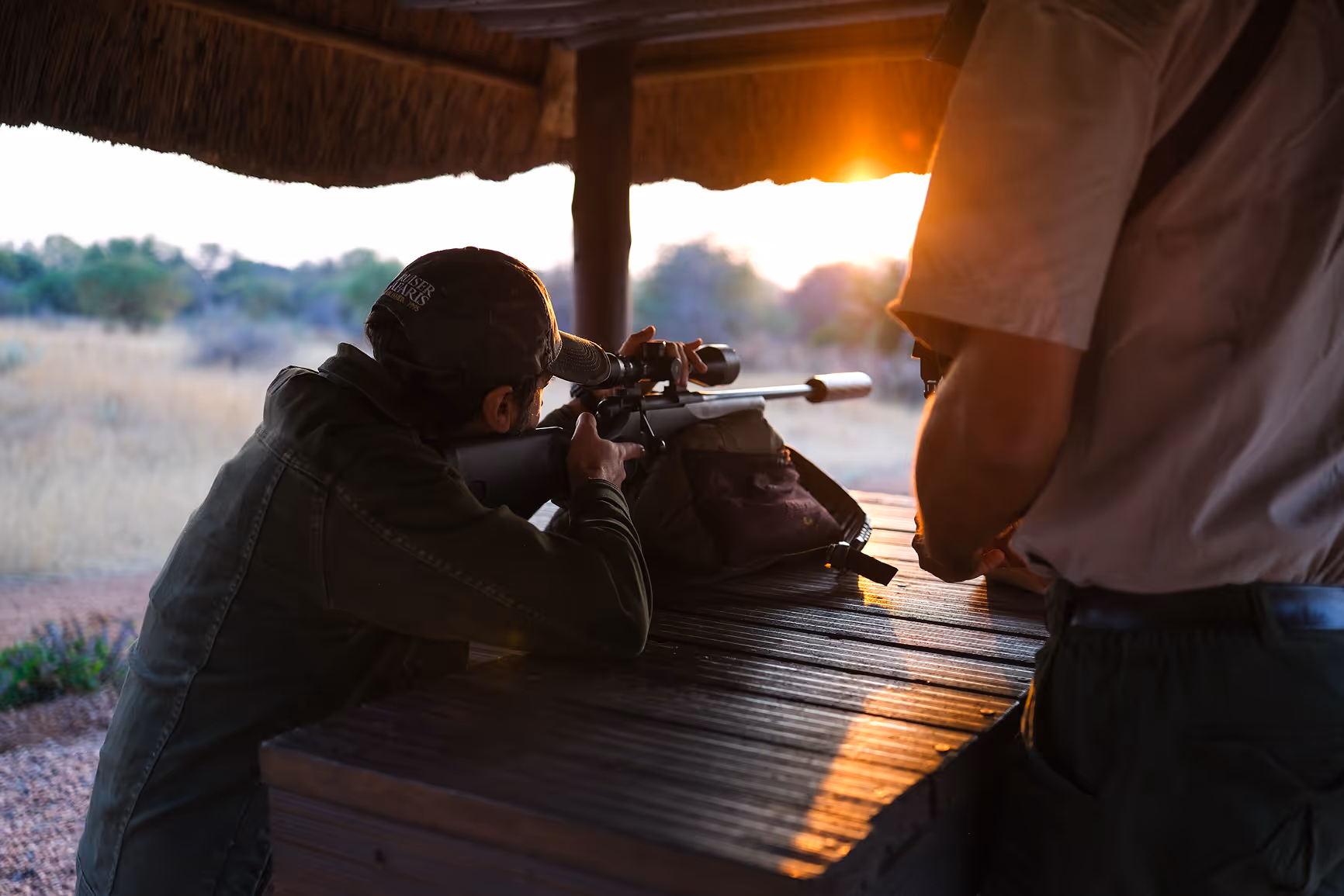 A hunter sighting in a rifle at the Cruiser Safaris shooting range